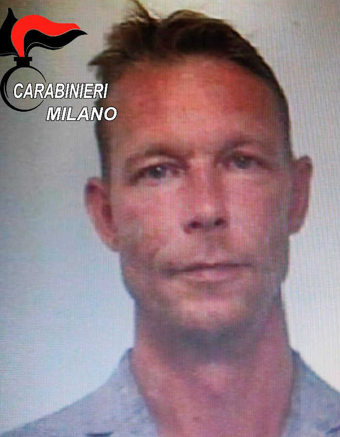 Close-up of a man&rsquo;s face with Carabinieri Milano logo, related to major update in search for Madeleine McCann anniversary.
