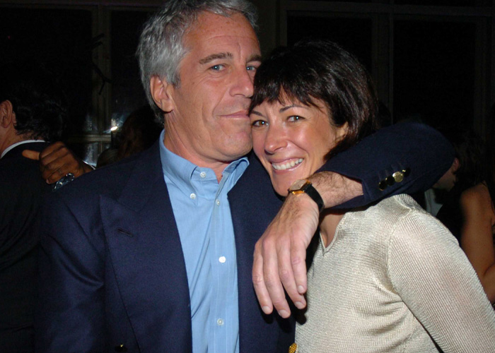 Man with gray hair in a blue shirt and dark jacket embracing smiling woman in light top during a night event discussing Madeleine McCann search update