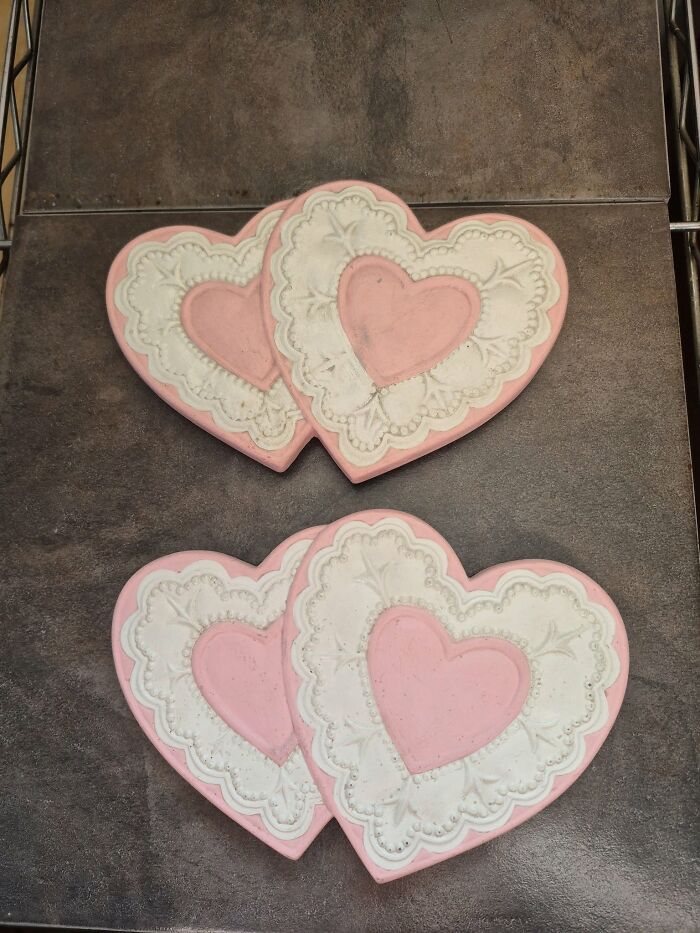 Heart-shaped decorated cookies on a dark surface illustrating eerie and odd experiences of unexplained people stories.
