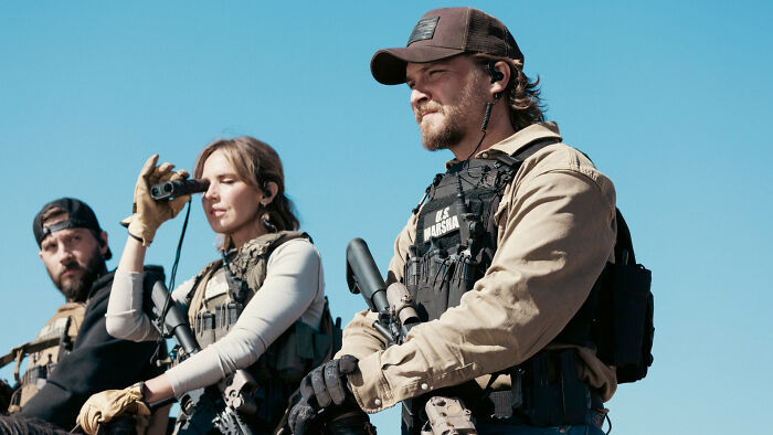 Three armed U.S. Marshals in tactical gear outdoors, related to Yellowstone fans and infamous location.