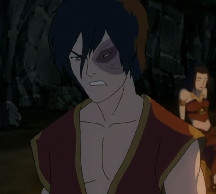 Animated man with a black eye, looking determined in a dark cave, illustrating men dropping the red pill mindset.