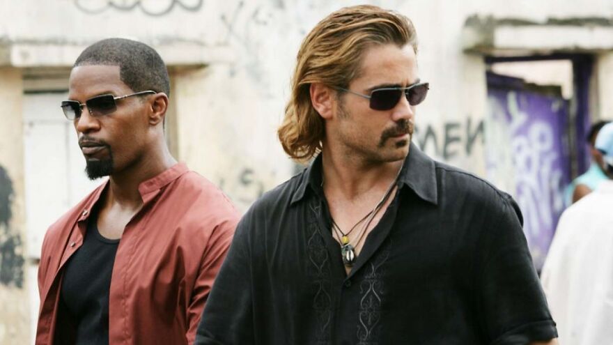 Michael B. Jordan and co-star wearing sunglasses in a scene from one of his upcoming movies after Oscar win.