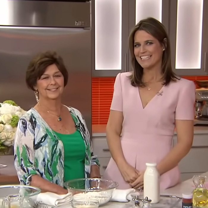 Two women in a kitchen setting with ingredients on the counter, related to the gloves Nancy Guthrie case mystery.