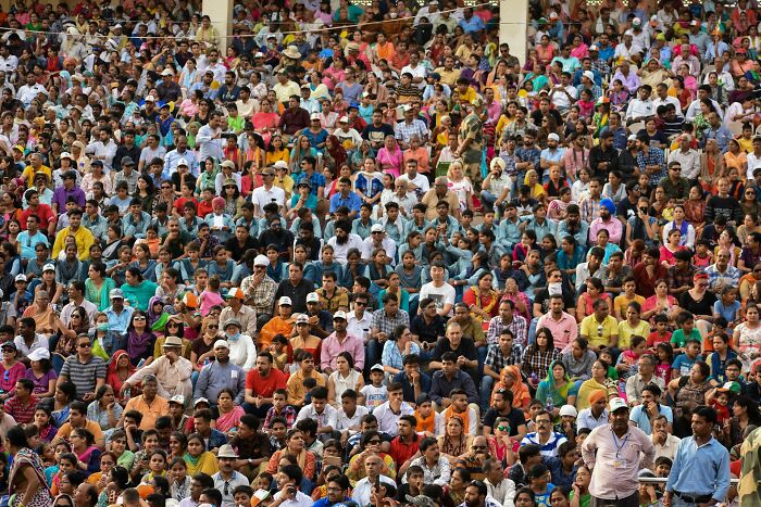 Crowd of diverse people gathered, illustrating hilarious and bizarre instances of culture shock experienced by foreigners.