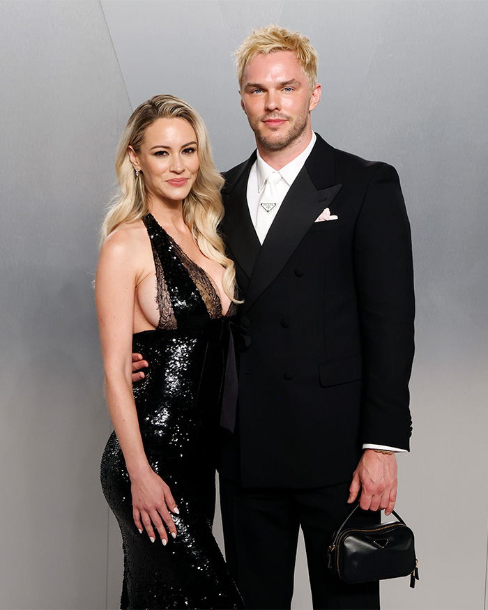 Model Bryana Holly in a black sequin dress with husband Nicholas Hoult at Oscars party, addressing body-shamers.