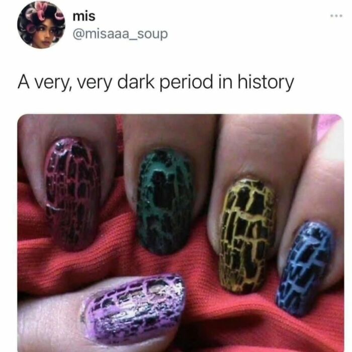 Close-up of multicolored cracked nail polish on nails, a nostalgic trend that might transport millennials back to childhood.