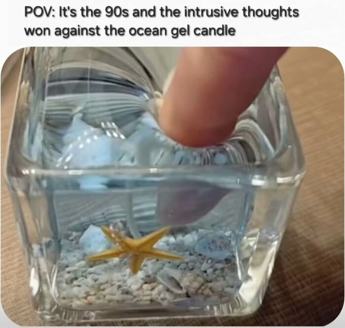 Finger pressing a 90s ocean gel candle with starfish and shells, evoking nostalgia for millennial childhood memories.