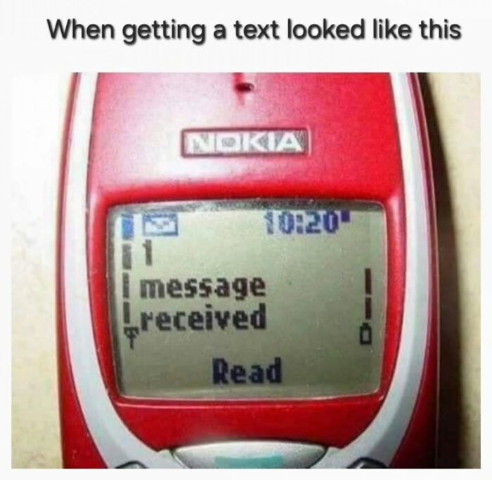 Old red Nokia phone screen showing a received text message, evoking nostalgia for millennial childhood memories.