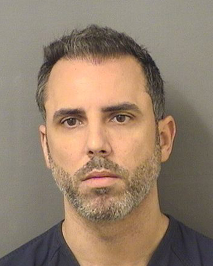 Mugshot of man arrested in connection with nurse's chilling final text amid lurid affair and slaying investigation.