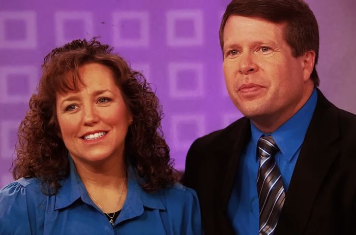 Couple in matching blue outfits in a studio setting, related to Joseph Duggar&rsquo;s past comments on brother Josh&rsquo;s misconduct.