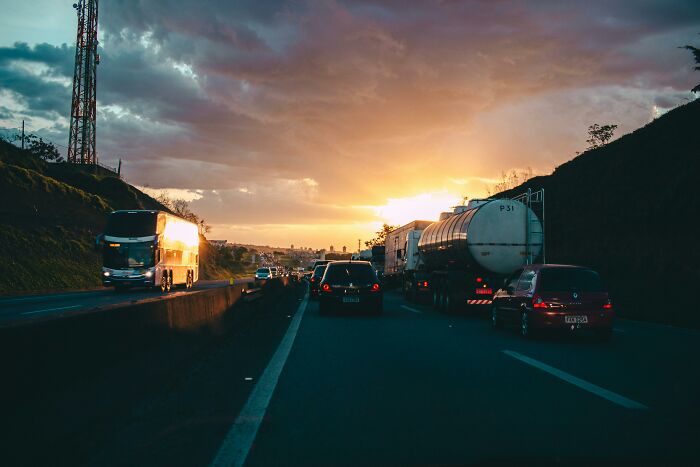Cars and trucks on a highway at sunset, illustrating criminals who tried to cover up their crimes in dumb ways.