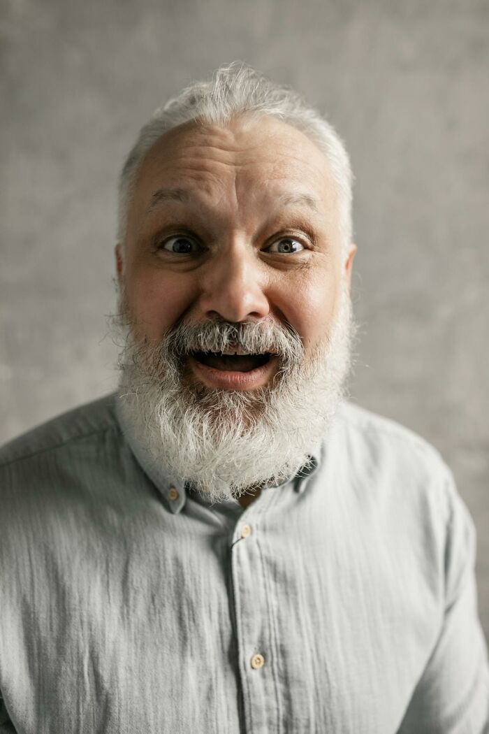 Elderly man with white beard looking surprised and amused, capturing moments people said that sounded like a complete joke.