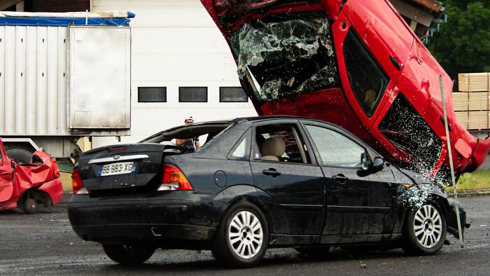 Severe car crash scene showing damaged vehicles, illustrating horrible things medical staff saw in the ER.