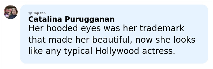 Anne Hathaway smiling at an event, revealing the trick behind her taut face after Oscars appearance scrutiny.