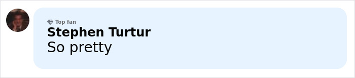 Anne Hathaway smiling warmly in a casual setting, revealing her trick behind a taut face after Oscars scrutiny.