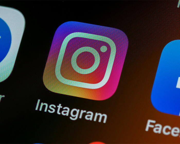 Close-up of smartphone screen showing Instagram app icon, related to Prince Harry's hand movements sparking concern.