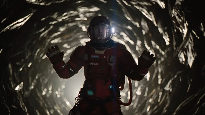 Astronaut in a spacesuit inside a dark tunnel, relating to Project Hail Mary and Ryan Gosling's box office potential.