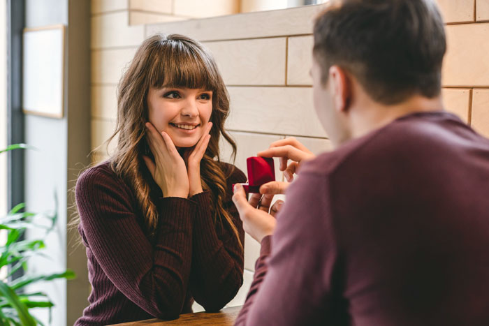 Woman happily reacts as fianc&eacute; proposes with a dream ring that comes with an $18,000 price tag.