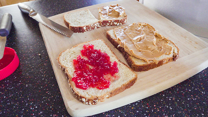Lady Won't Stop Eating Peanut Butter Because Roomie's Unannounced Guest Is Allergic, Drama Ensues