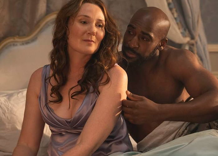 Ruth Gemmell in an emotional scene filming an intimate sequence for Bridgerton, showing vulnerability and connection.