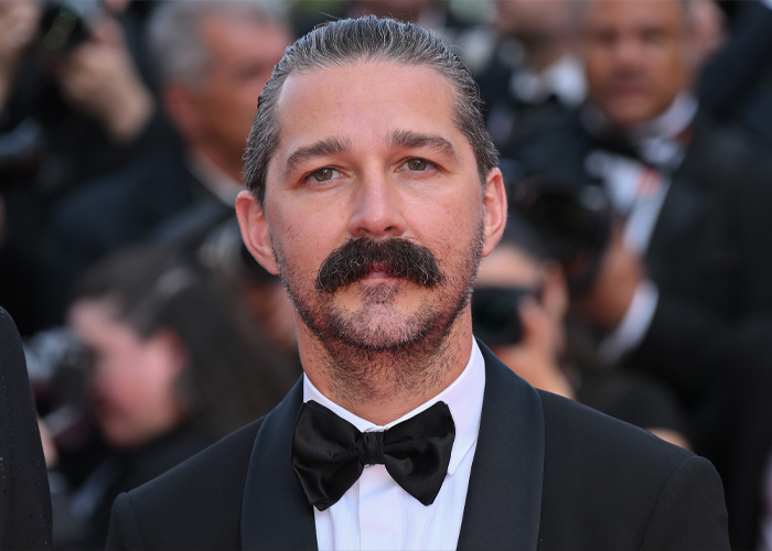Shia LaBeouf wearing a black tuxedo and bow tie at a formal event, addressing his Mardi Gras arrest and mental health.