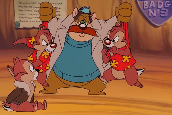 Animated characters Chip and Dale with a large cartoon figure in a playful scene, evoking childhood memories and nostalgia.