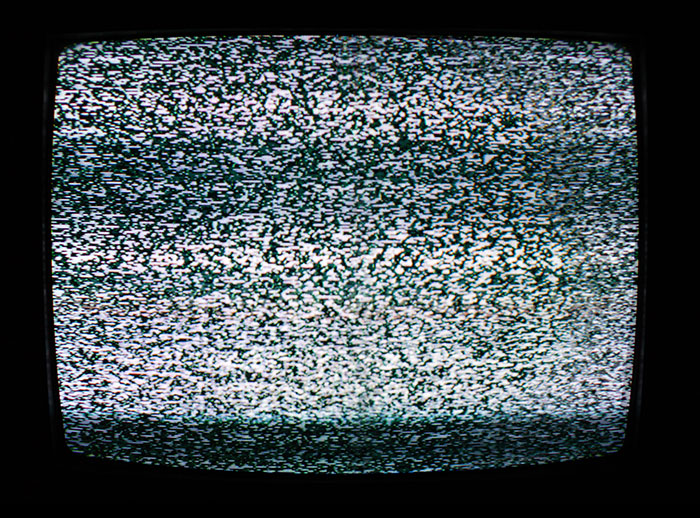 Static screen on an old television, evoking childhood memories and nostalgic moments from past experiences.