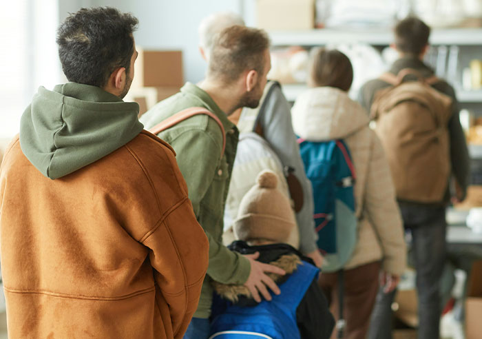 People standing in line, showing eye-opening moments of realizing they were truly spoiled in a casual setting.