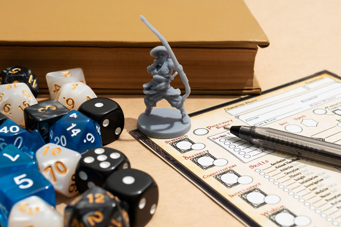 DnD figurine and dice on character sheet with a pen and book, representing a DnD guest caught stealing manga and figurines.
