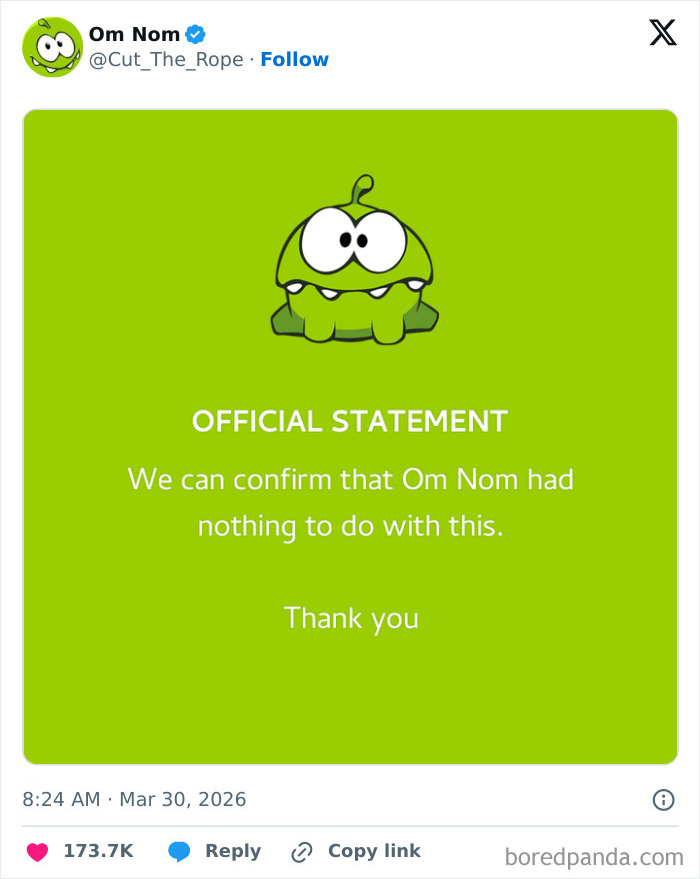 Tweet from Om Nom character denying involvement in 12 tons of KitKat theft, shown on a bright green background.