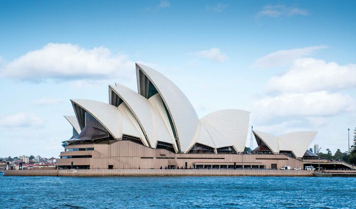 Sydney Opera House iconic landmark viewed from the water under clear sky, illustrating popular myths about landmarks.