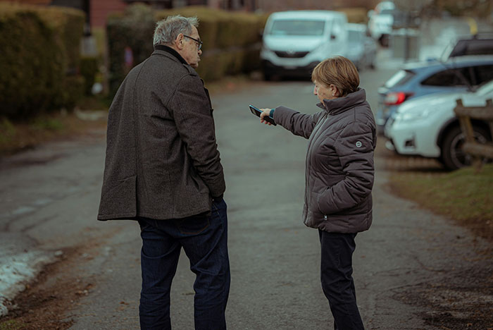 Man and boy outdoors discussing DNA paternity results, highlighting a mix-up and desire to reconnect after disowning son.