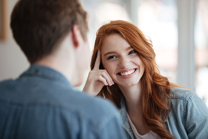Young man and woman having a heartfelt conversation, representing things men keep to themselves but want to tell women.