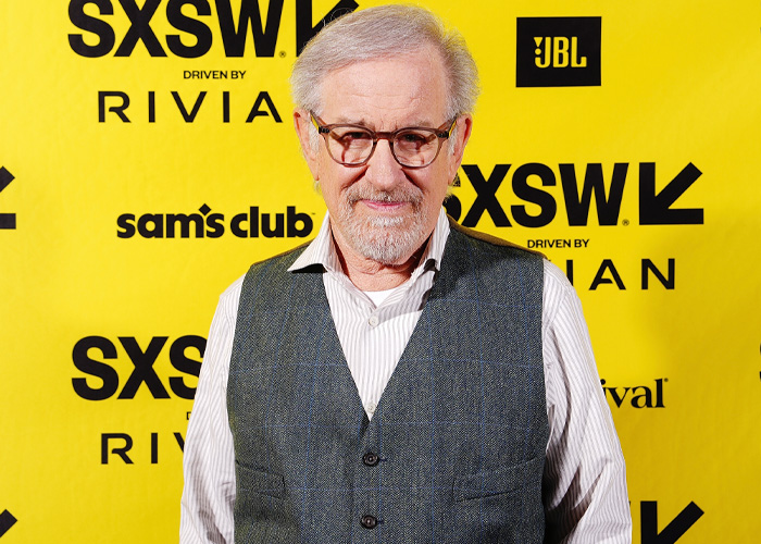 Steven Spielberg wearing glasses and a vest at SXSW event, ahead of Oscars controversy involving Timoth&eacute;e Chalamet as a sage.