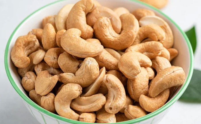 Bowl of cashew nuts showcasing healthy brain food to support humans neurologically entering adulthood at age 32.
