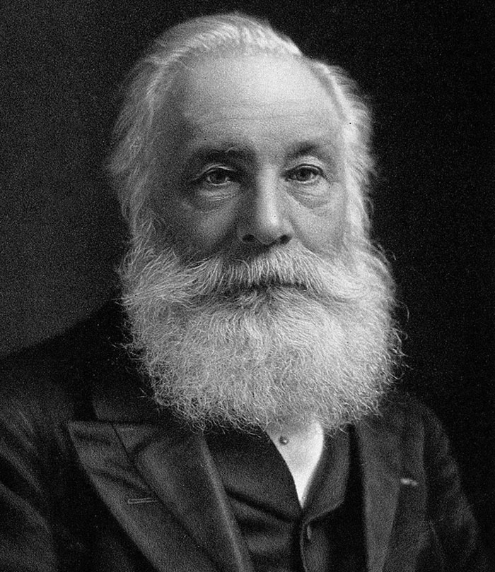 Black and white portrait of an elderly man with a full white beard, symbolizing maturity and adulthood development.