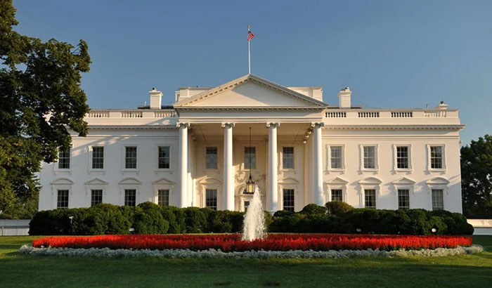 The White House with a fountain and flowerbed in front, illustrating adulthood neurological facts at age 32.