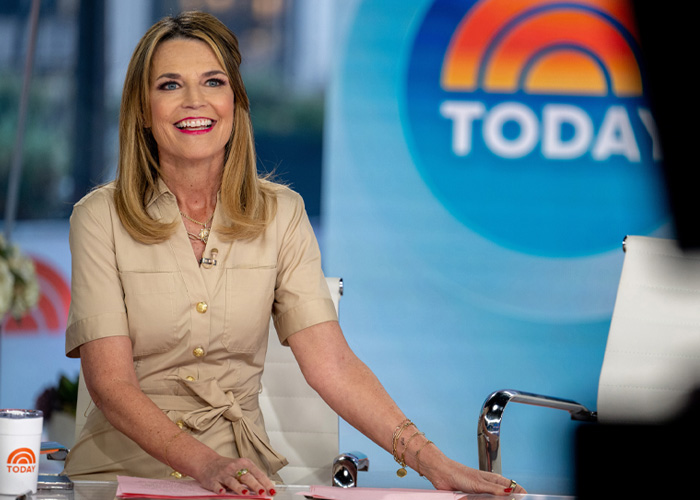 Savannah Guthrie on the Today show set, smiling during a segment amid behind-the-scenes toxic drama reports.