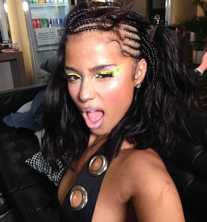 Tyla wearing a bizarre adhesive top styled like Bianca Censori's disciple look, sparking wild reactions at Paris Fashion Week.