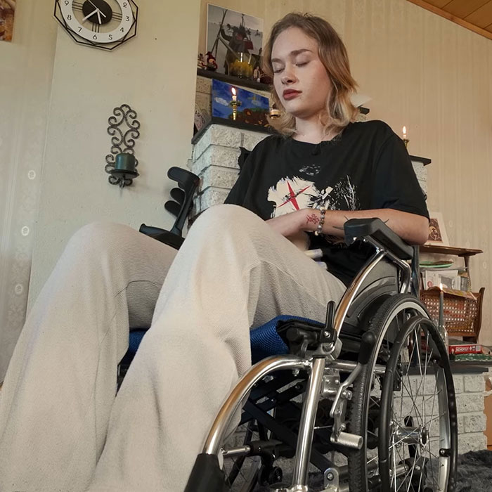 Young model in a wheelchair indoors showing recovery from horrific injuries as she reveals her comeback journey.