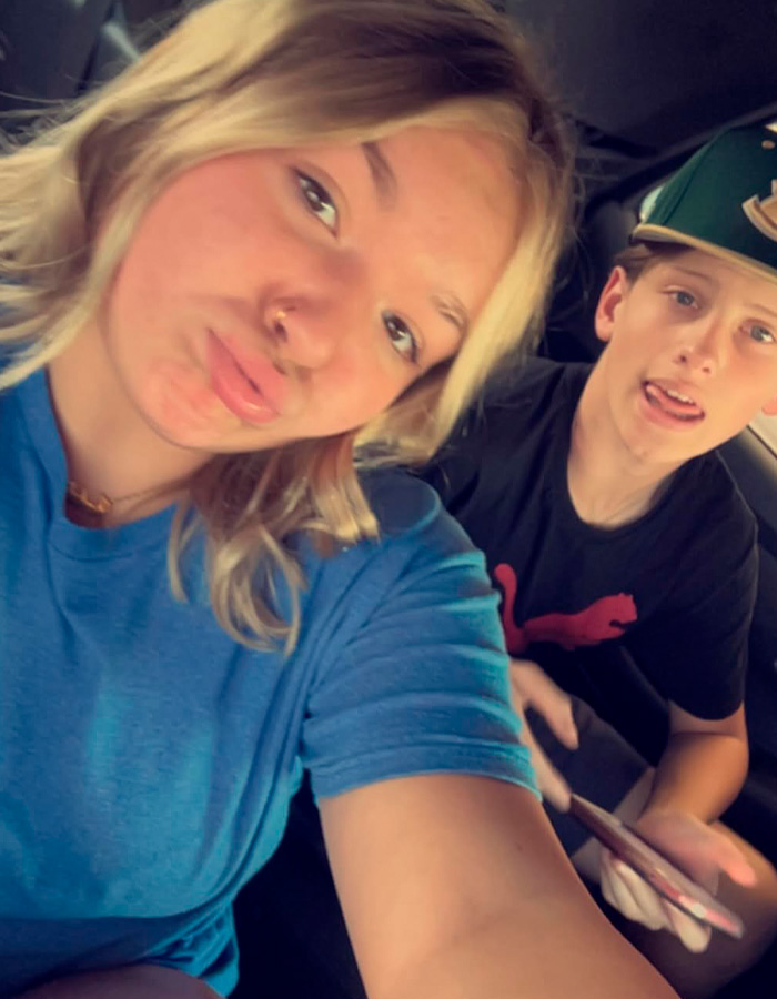 Teen girl and boy in casual clothing sitting in a car, related to controversial case involving pregnant 15-year-old and 12-year-old.
