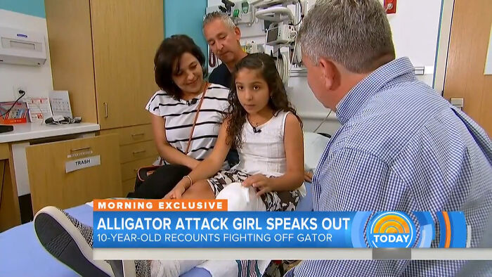 Young girl recounts alligator attack while sitting with family and medical staff in a hospital setting, highlighting disturbing real life events.