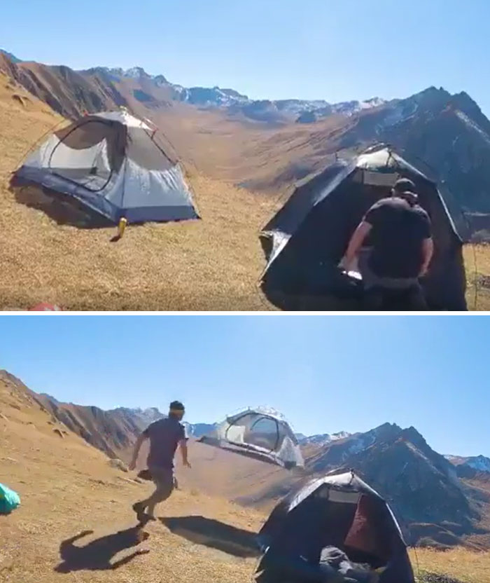 Man running after a tent flying away in strong wind during a camping disaster in mountainous terrain outdoors.