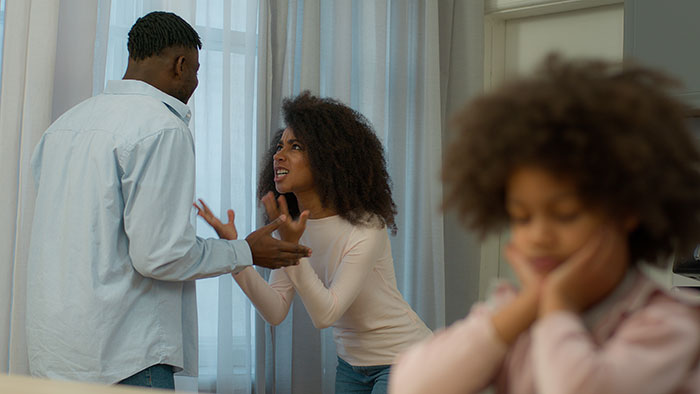 Wife confronting husband angrily as daughter looks upset, illustrating conflict over vegan-hating attitudes and ruined friendship.