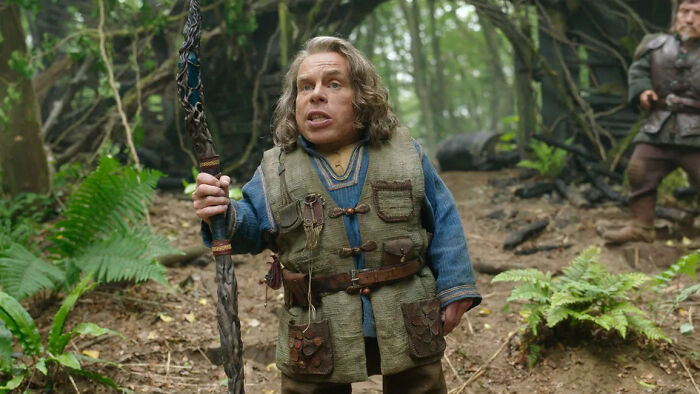 Fantasy TV show character holding a staff in a forest scene, representing popular TV shows with episodes removed from streaming platforms.