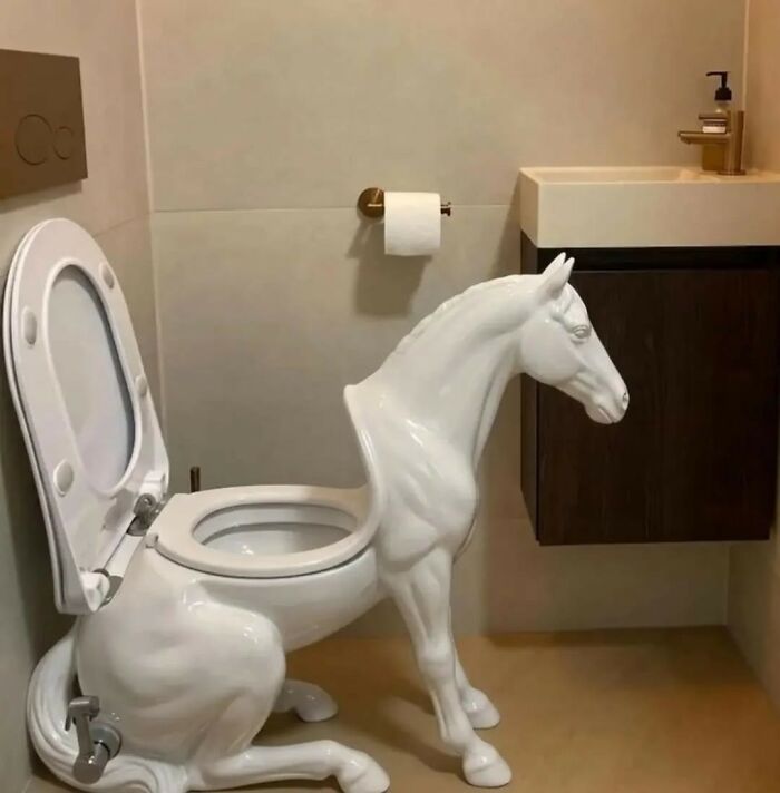 A white horse-shaped toilet in a modern bathroom. This weird image made people go hmmm.