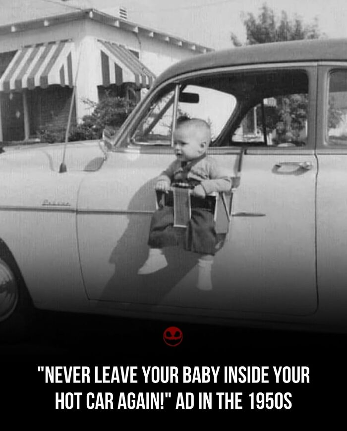 Black-and-white photo of a vintage 1950s car with a baby in a door-mounted baby seat, odd facts photo.