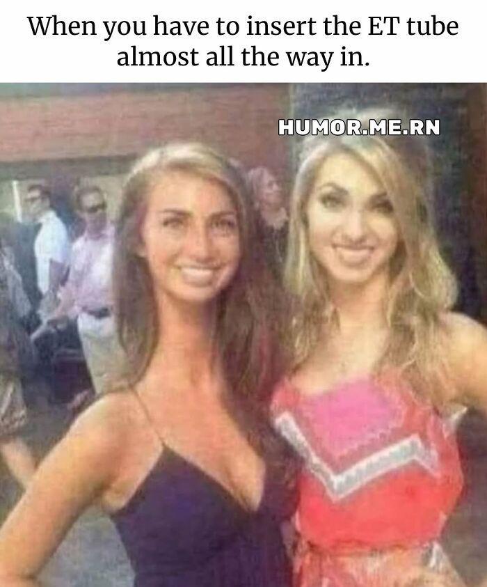 Two women smiling at a party, featured in a funny healthcare meme about inserting an ET tube almost all the way in.