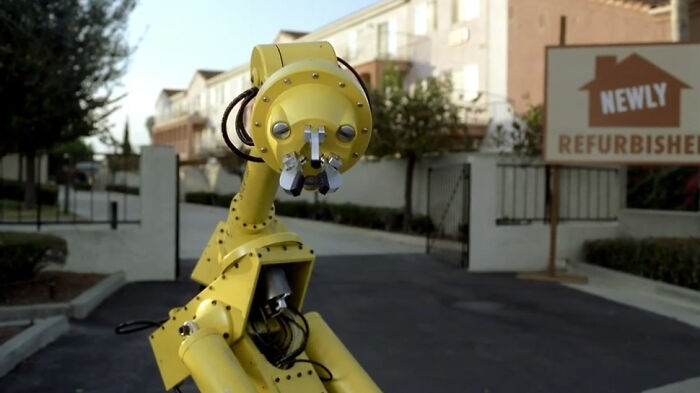 Yellow robot in a residential area, symbolizing PR mistakes that companies didn’t expect to backfire.