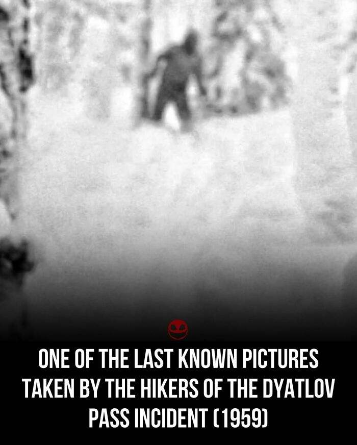 Blurry black and white photo related to weird and odd facts showing a figure from the Dyatlov Pass incident in 1959.
